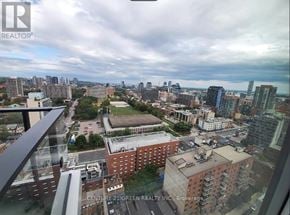 Toronto (Church-Yonge Corridor) condo for rent - A view of a city from a high vantage point with the text "CENTURY 21 GREEN REALTY INC. Brokerage" visible.