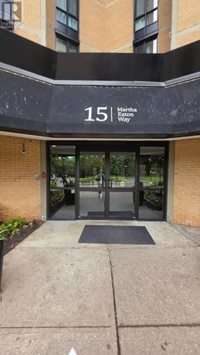 Toronto (Brookhaven-Amesbury) condo for rent - The front of a building with a black awning that reads "15 Martha Eaton Way".