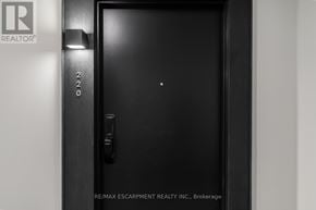Hamilton (Lakeshore) condo for rent - A black door with a handle and a lock.
