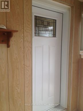 Oshawa (Central) apartment for rent - A white door with a glass window in the middle.