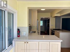 Toronto (High Park-Swansea) apartment for rent - A kitchen with a white countertop and cabinets.