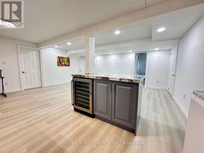 Richmond Hill (Rouge Woods) apartment for rent - A spacious room with a marble countertop and wooden flooring.