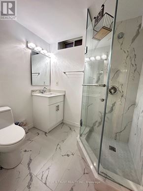 Richmond Hill (Rouge Woods) apartment for rent - A white bathroom with marble floors and a walk in shower.
