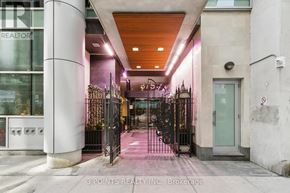 Toronto (Waterfront Communities) condo for rent - The entrance to a building with a sign that reads "3 Points Realty Inc. Brokerage".