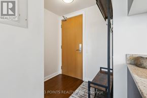 Toronto (Waterfront Communities) condo for rent - A room with a wooden door and a small staircase.