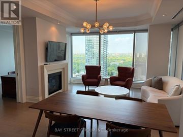 Toronto (Annex) condo for rent - A living room with a wooden table and chairs.