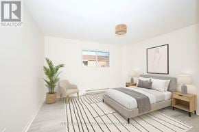 Welland (Lincoln/Crowland) multi-family for rent - A bedroom with a bed, chair, and plant.
