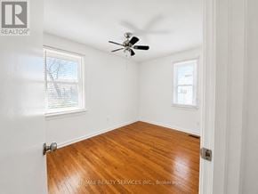 Hamilton (Ainslie Wood) apartment for rent - A room with a ceiling fan and wooden flooring.