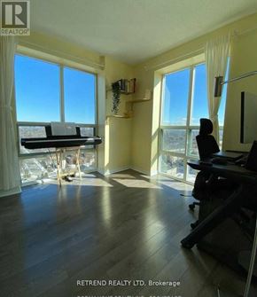 Toronto (Willowdale East) condo for rent - A room with a piano and a view of the city.