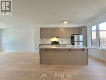 Markham townhouse for rent - A kitchen area with a countertop and cabinets.
