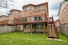 Newmarket (Stonehaven-Wyndham) apartment for rent - A large house with a deck and a staircase leading to it.