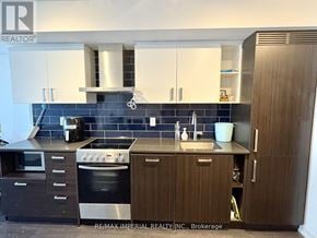 Toronto (Mount Pleasant West) condo for rent - A kitchen with a stove, oven, and sink.