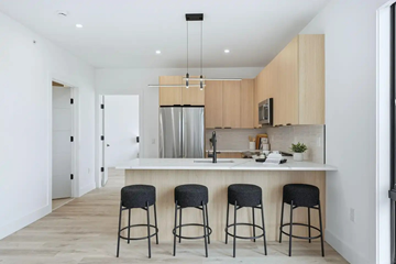 Hackensack apartment for rent - A kitchen with a bar stool in front of the counter.