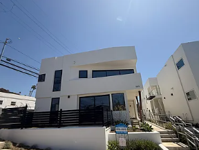 San Clemente apartment for rent - A white building with a black railing in front of it.