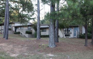 Griffin apartment for rent - A row of houses with trees in front.