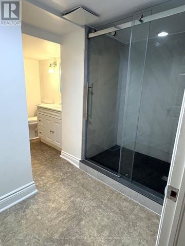 Burlington (Lasalle) apartment for rent - A bathroom with a walk-in shower and a toilet.