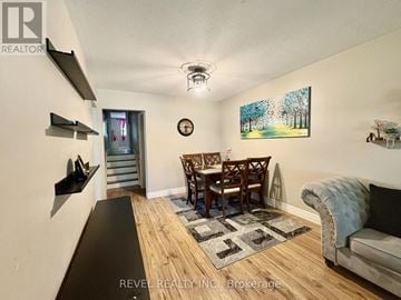 Shelburne apartment for rent - A living room with a couch, chairs, and a painting on the wall.