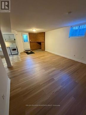 Toronto (Highland Creek) apartment for rent - A room with wooden floors and white walls.