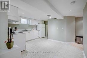 Richmond Hill (Crosby) apartment for rent - A white kitchen with a vase of flowers on the counter.
