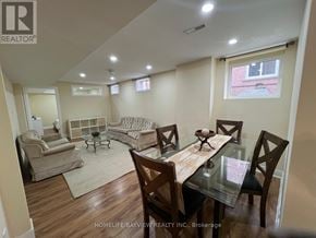 Newmarket (Armitage) apartment for rent - A dining room with a glass table and chairs.