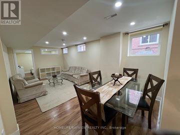 Newmarket (Armitage) apartment for rent - A dining room with a glass table and chairs.