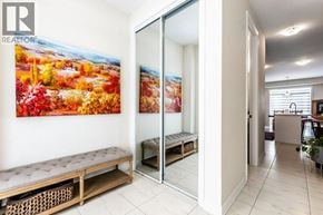 Breslau apartment for rent - A living room with a large painting of a fall scene on the wall.