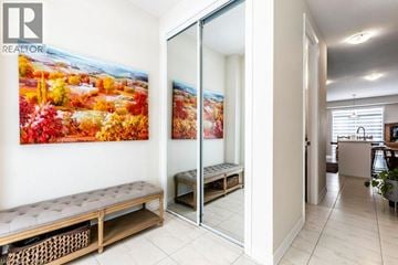 Breslau apartment for rent - A living room with a large painting of a fall scene on the wall.