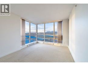Richmond apartment for rent - A large, empty room with a view of a waterfront.
