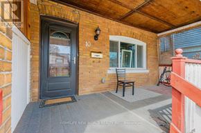 Toronto (The Beaches) apartment for rent - A small porch with a black door and a bench.
