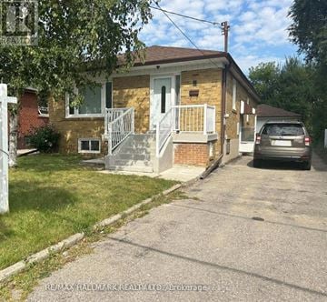 Toronto (Maple Leaf) apartment for rent - A small house with a car parked in front.