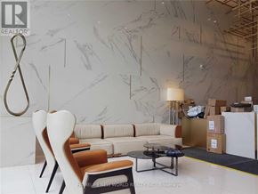Toronto (Church-Yonge Corridor) condo for rent - A modern living room with a marble wall and a coffee table.