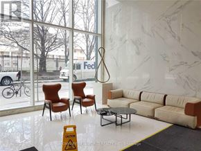 Toronto (Church-Yonge Corridor) condo for rent - A living room with a sofa, chairs, and a table in front of a large window.