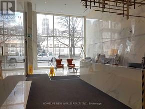 Toronto (Church-Yonge Corridor) condo for rent - A lobby with a glass wall and a sign that says REALTOR.