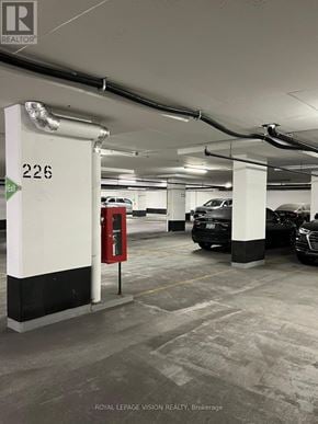 Toronto (Woburn) condo for rent - A parking garage with the number 226 on a sign.