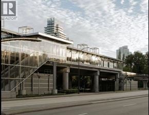 Burnaby apartment for rent - A modern building with a glass facade and a metal staircase.