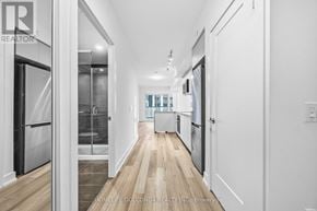 Markham (Unionville) condo for rent - A long hallway with white walls and wood floors.