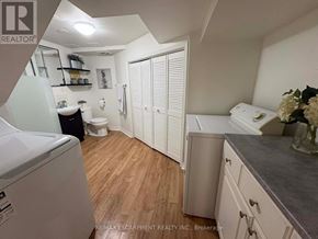Hamilton (Sunninghill) apartment for rent - A kitchen with a refrigerator, sink, and cabinets.