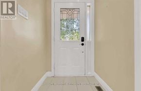 Brampton (Madoc) apartment for rent - A white door with a glass window in the middle of a room.