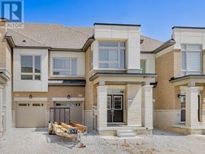 Brampton (Northwest Brampton) townhouse for rent - A house with a garage and a driveway in front of it.