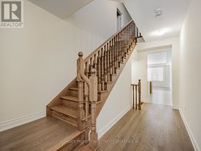 Brampton (Northwest Brampton) townhouse for rent - A wooden staircase in a property investment brokerage.