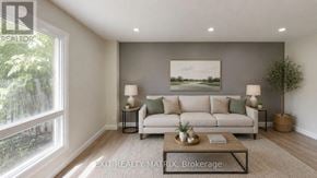 Ottawa townhouse for rent - A well-lit living room with a large window and a painting on the wall.