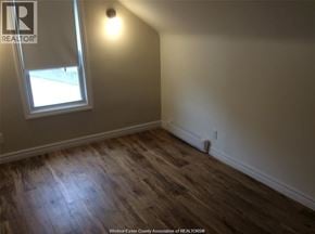 Windsor apartment for rent - A room with a window and wooden flooring.