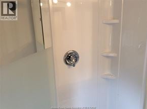 Windsor apartment for rent - A white door with a silver handle in a bathroom.