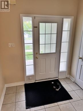 Milton (Cl Clarke) apartment for rent - A black mat is on the floor in front of a white door.