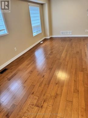 Milton (Cl Clarke) apartment for rent - A room with wooden flooring and a window.