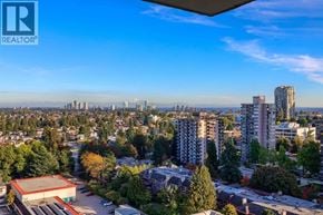 Burnaby apartment for rent - A cityscape with a clear blue sky and tall buildings.