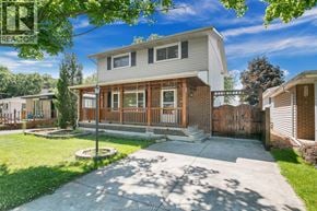 Windsor apartment for rent - A house with a white exterior and a wooden deck is for sale.