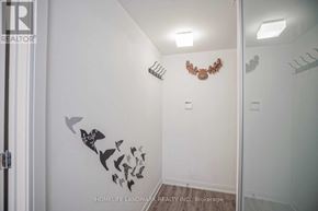 Toronto (Church-Yonge Corridor) condo for rent - A white bathroom with a mirror and a wall decal of birds.