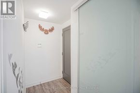 Toronto (Church-Yonge Corridor) condo for rent - A room with a white wall and a brown decoration on it.