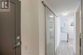 Toronto (Church-Yonge Corridor) condo for rent - A hallway with a glass door and a white door.